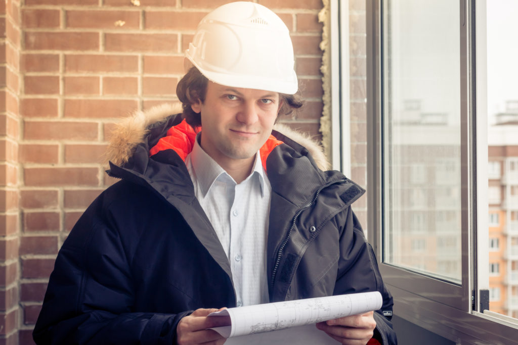 man holding a blueprint