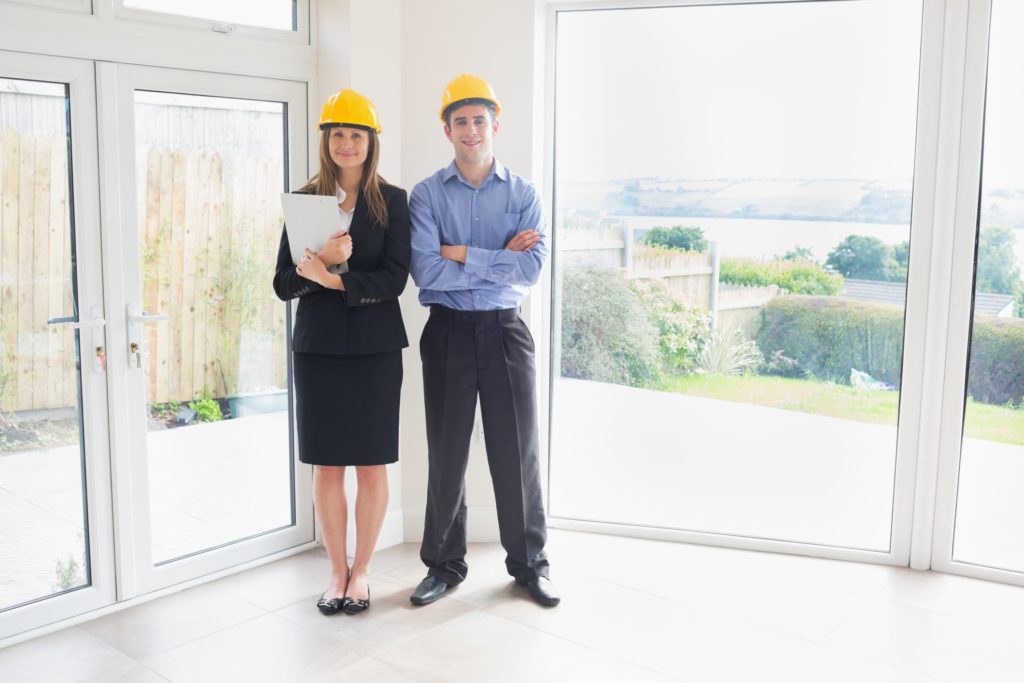 man and woman wearing hardhat