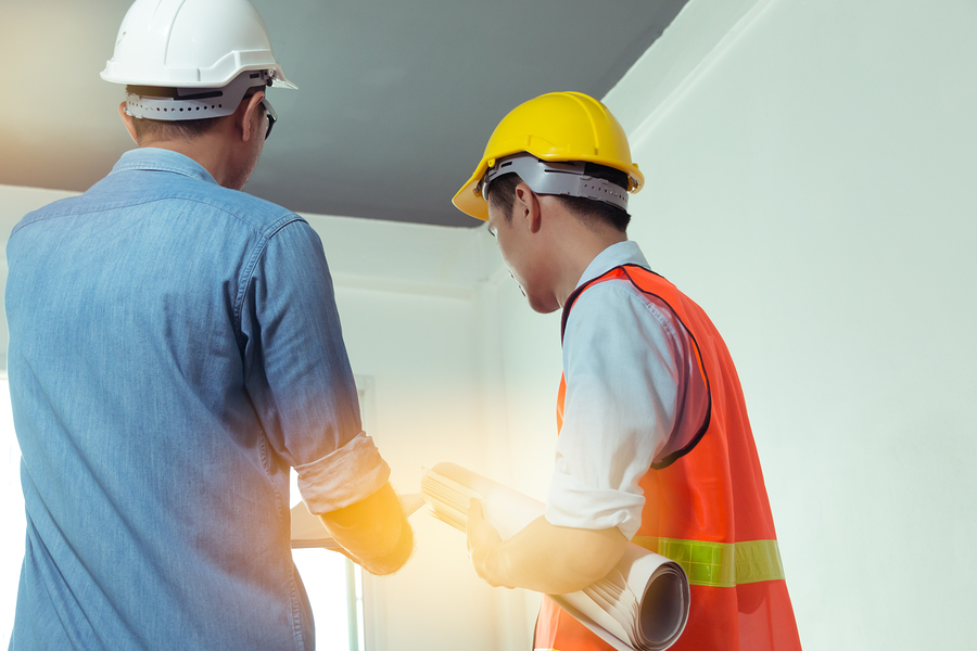 architects and engineers examine the interior of the home to create a successful building plan before delivering quality housing to the customer.