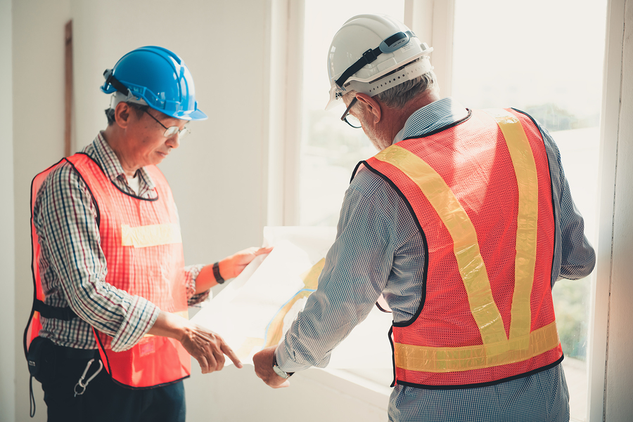 senior men were inspected civil work in construction site.