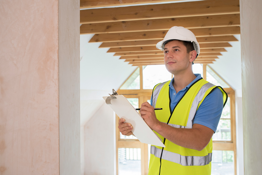 building inspector looking at the interior of new property